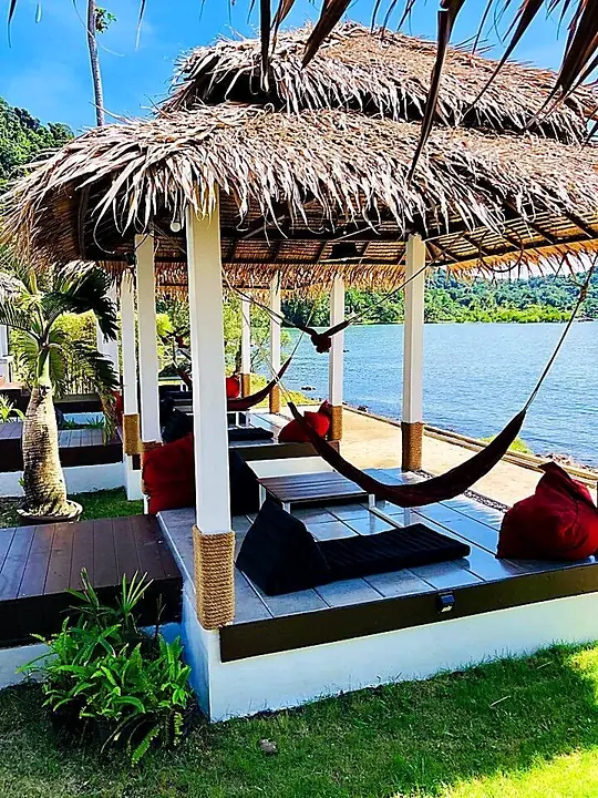 Cabana with hammocks above the water
