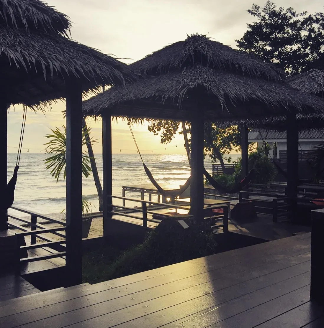 Cabanas on the deck with a hammock at dusk