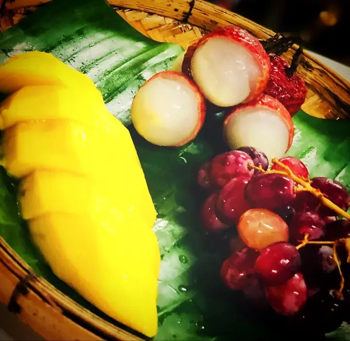 Plate of mango, rambutan and tropical fruit
